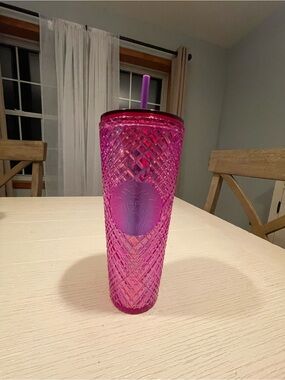 Pink Starbucks tumbler with diamond-cut pattern and purple logo